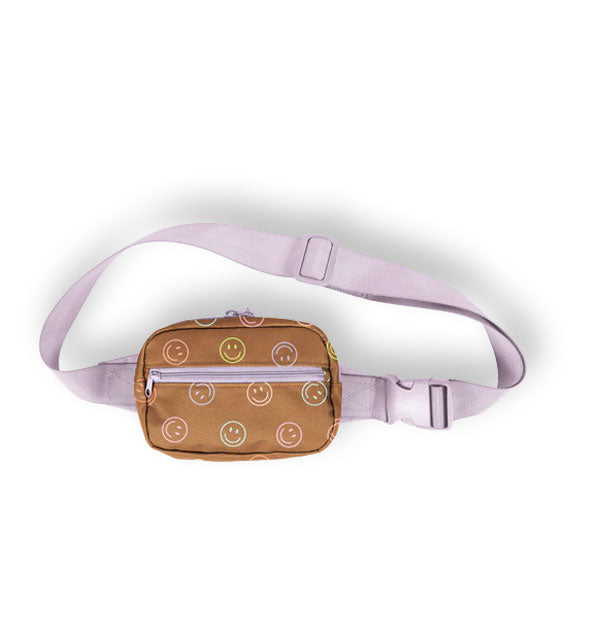 Small brown hip bag with print of multicolored pastel smiley faces features purple zippers and adjustable strap