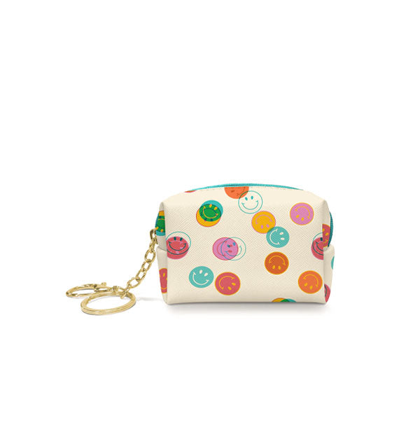 Small white pouch with colorful smiley face print and attached gold keychain hardware