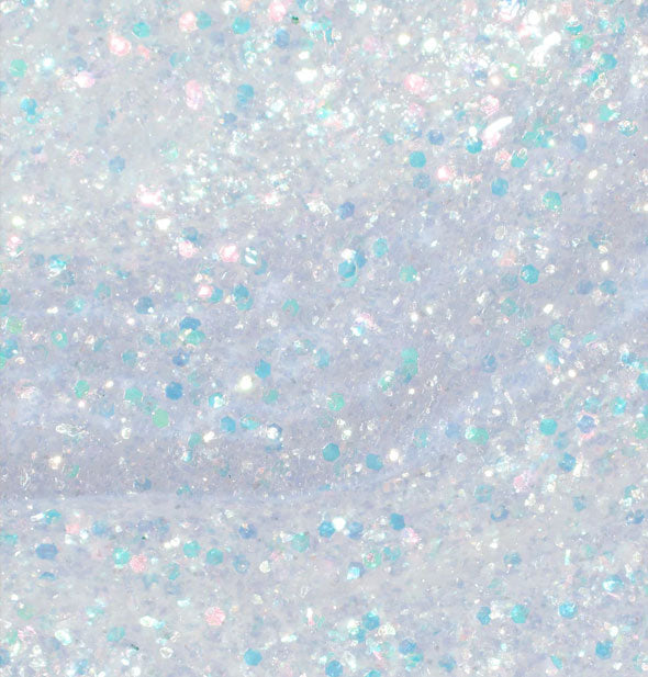 Closeup of shimmery silvery nail polish with blueish flecks throughout