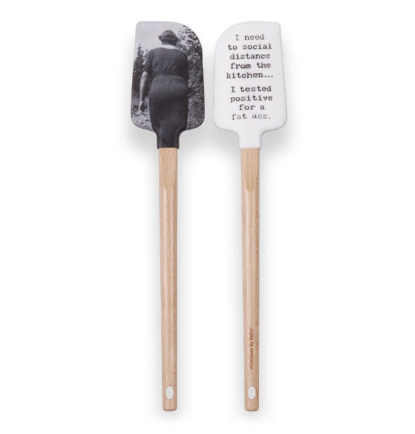 Double sided scraper spatula with wooden handle features a vintage black and white photo of the back of a woman on one side and the phrase, "I need to social distance from the kitchen...I tested positive for a fat ass" printed in black on a white background on the other side