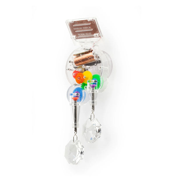 RainbowMaker with attached top solar panel and hanging crystals features clear housing that reveals colorful gears inside