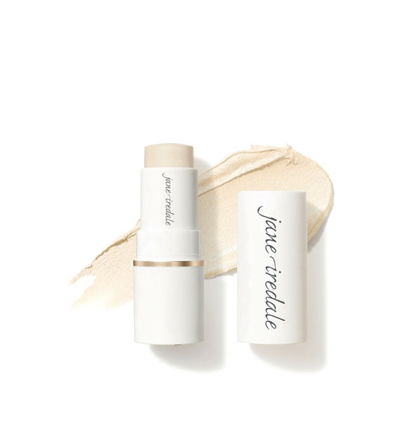 White tube of Jane Iredale Glow Time Highlighter Stick with cap removed overtop an enlarged sample product application in shade Solstice
