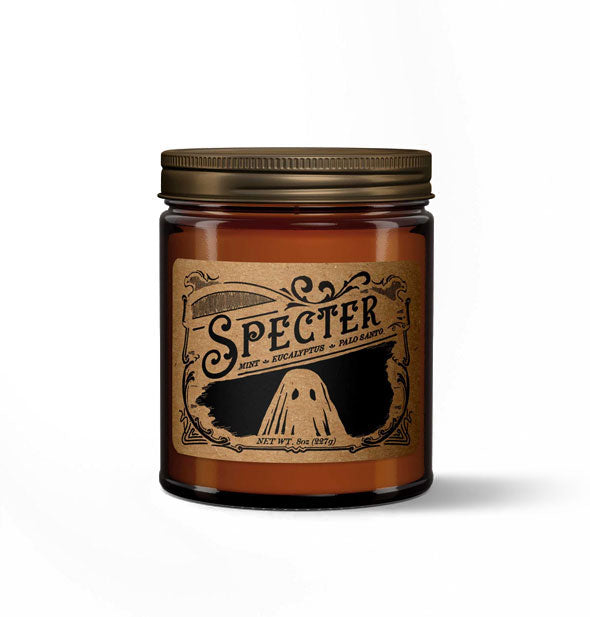 Specter candle in amber glass jar with metal lid features a kraft paper label in a vintage style with ghost illustration