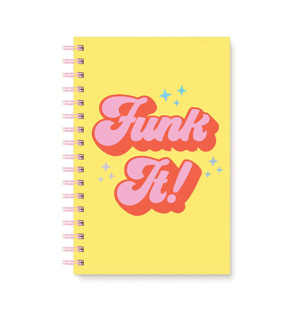 Yellow notebook with pink spiral binding says, "Funk It!" in large retro-style pink script lettering accented by blue stars