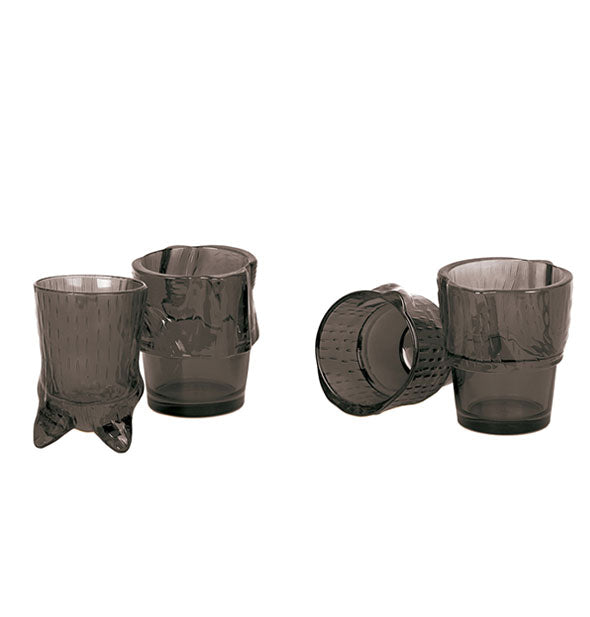 Set of clear black drinking glasses with stackable design form four parts of a cat's body