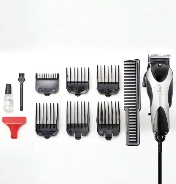 Inclusions of the Wahl Sterling 4 Vibrator Clipper set: six attachment combs, styling comb, red blade guard, cleaning brush, and oil vial
