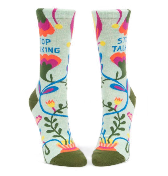 Crew socks with colorful floral design printed with "Stop Talking" on the outer ankle