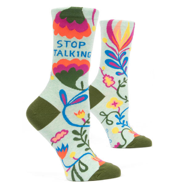 Crew socks with colorful floral design printed with "Stop Talking" on the outer ankle