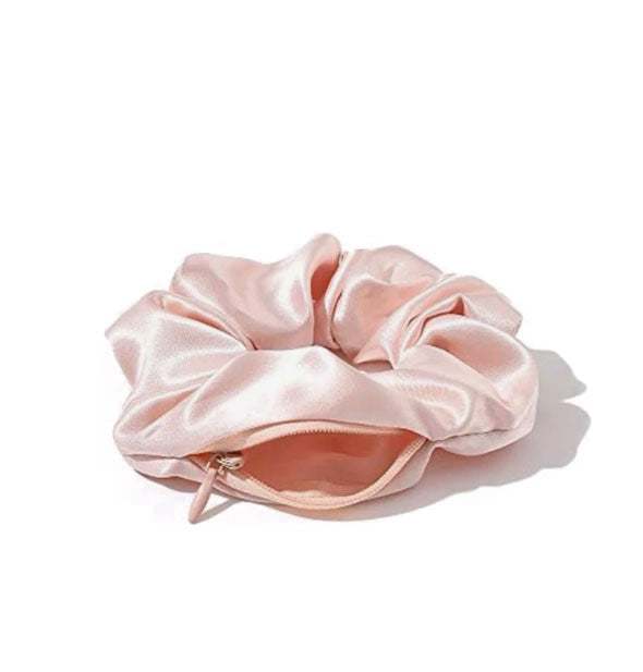 Pink satin hair scrunchie with zipper storage pocket