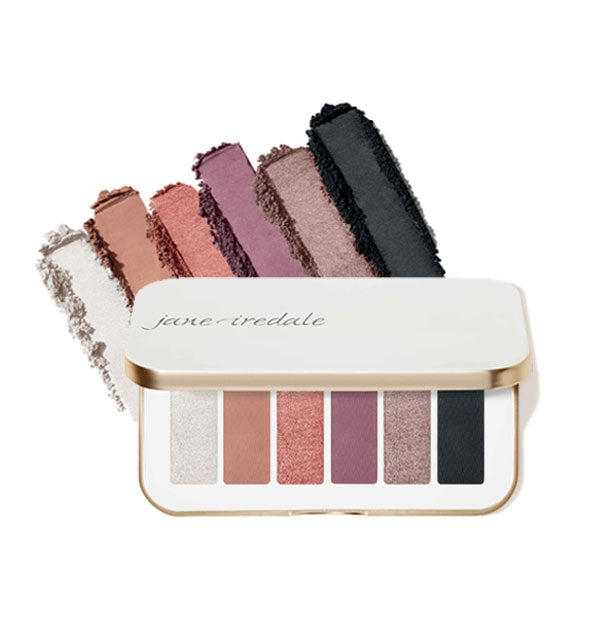 Opened white rectangular Storm Chaser Jane Iredale eye shadow palette features six shades in cool tones mixing matte and shimmer and ranging from light neutral to dark jewel tones
