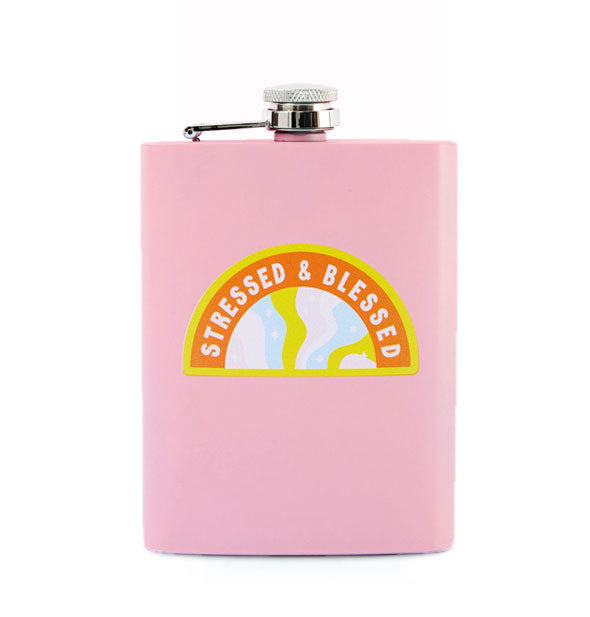 Rectangular pink flask with steel cap says, "Stressed & Blessed" in an arced shape