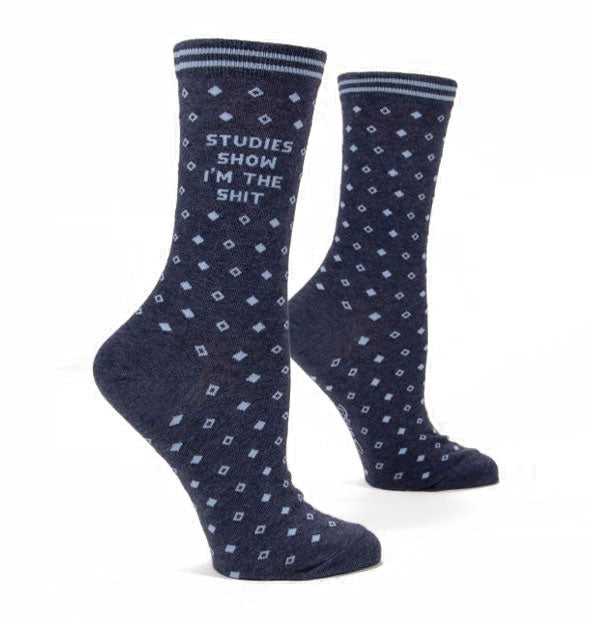 Pair of dark blue crew socks with small diamond pattern say, "Studies show I'm the shit" on the ankle