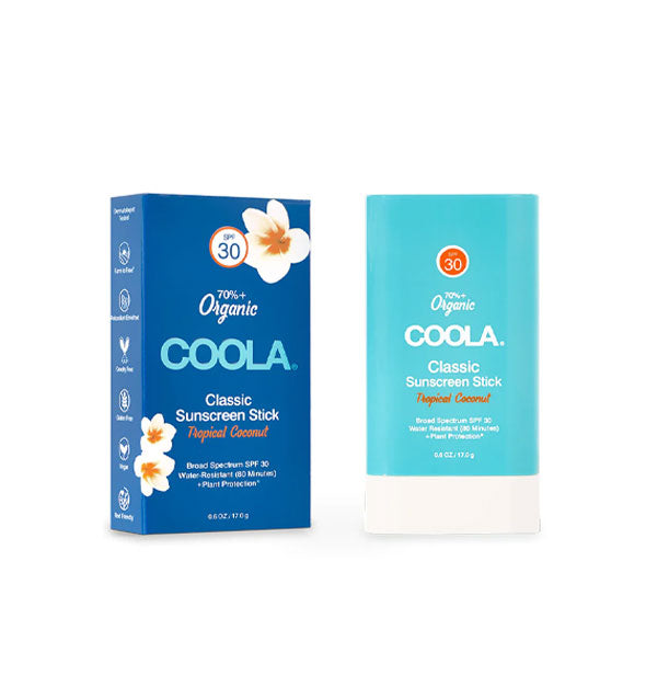 White and light blue stick of Coola Classic Sunscreen Stick with dark blue box featuring white tropical flower accents