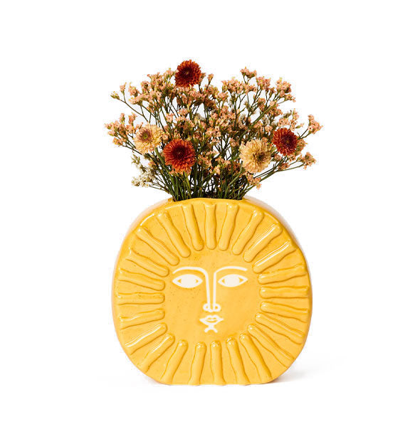 Sun vase holds a bouquet of wildflowers