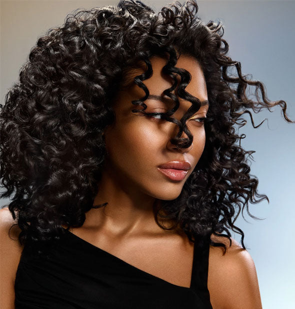 Model with shiny, healthy-looking curls