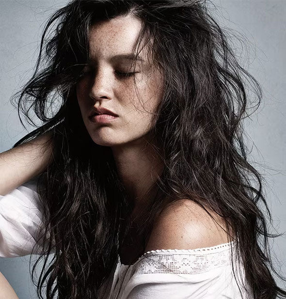 Model with long hair styled in tousled waves