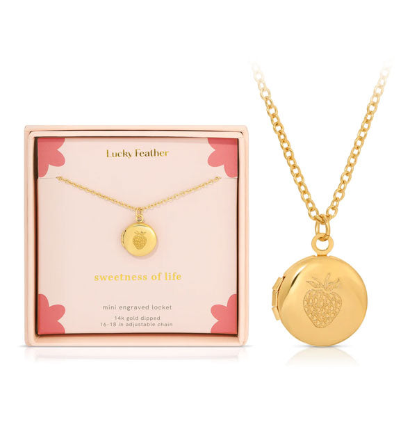 "Sweetness of Life" round gold engraved strawberry locket necklace is shown in detail next to its gift box packaging