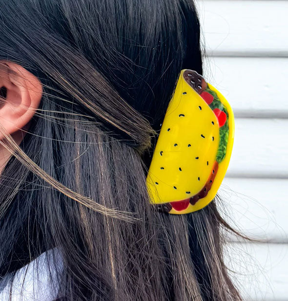 Model wears a hair clip designed to resemble a hard shell taco