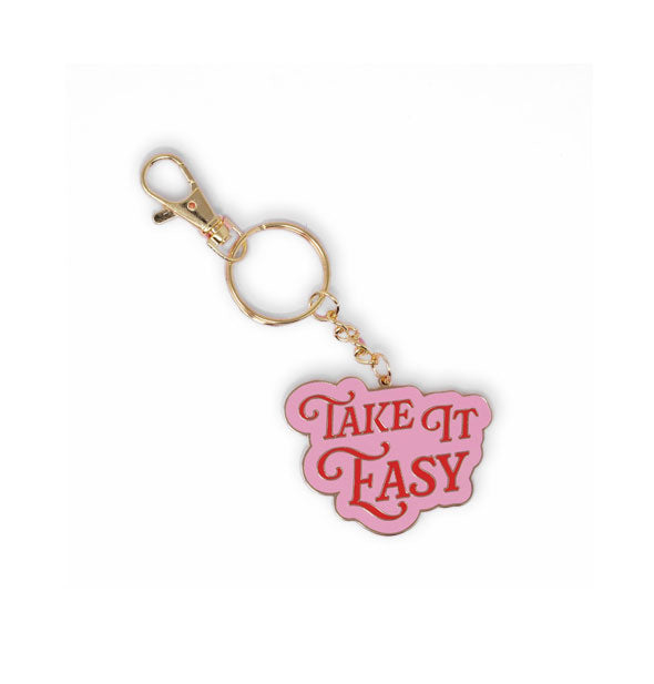 Pink enamel keychain with gold hardware says, "Take It Easy" in red lettering