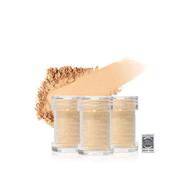 Three refill canisters of Jane Iredale Powder-Me SPF 30 Dry Sunscreen with enlarged swiped sample application behind them in shade Tanned