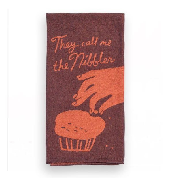 Brown and orange dish towel with illustration of a hand picking a piece of a muffin says, "They call me the nibbler"