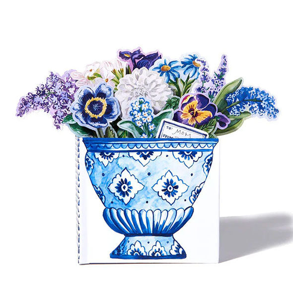 Book designed with a blue urn features fold-out flowers emerging from the top to form a bouquet