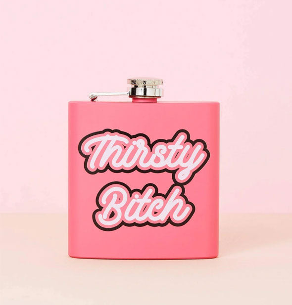 Dark pink square flask says, "Thirsty Bitch" in white script outlined in pink and black