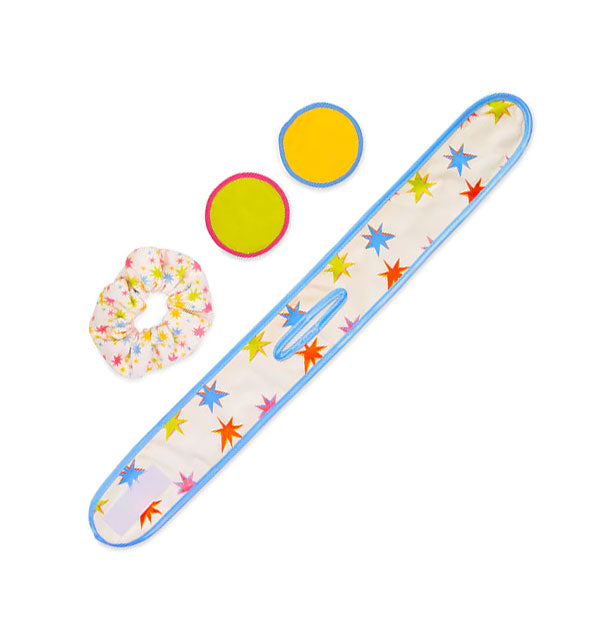Contents of the Time Out Home Spa Set: Retro star print head wrap, scrunchie, and colorful facial rounds
