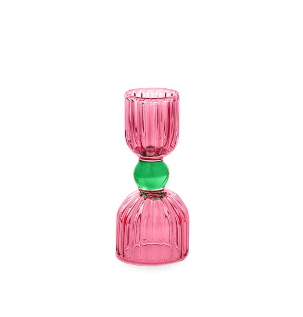 Two-tone pink and green faceted glass cocktail jigger with smaller pink top, middle green sphere, and larger bottom