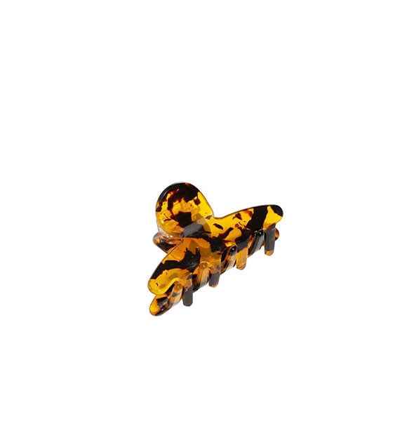 Clear amber tortoise claw clip with dark brown flecks