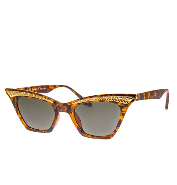 Pair of angular brown tortoise cat-eye sunglasses with metallic frame embellishment and gray lenses
