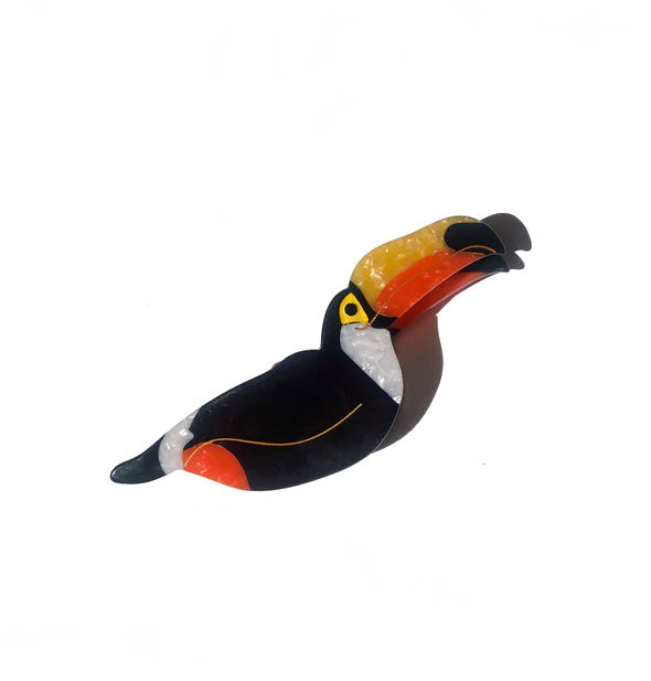 Black, white, yellow, and orange toucan claw clip with gold line details