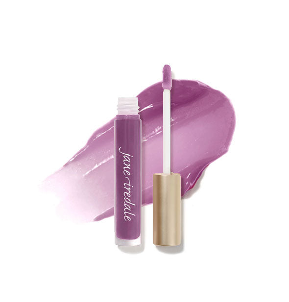 Tube of Jane Iredale HydroPure Hyaluronic Acid Lip Gloss with doe foot applicator cap removed and sample enlarged product application behind in shade Tourmaline