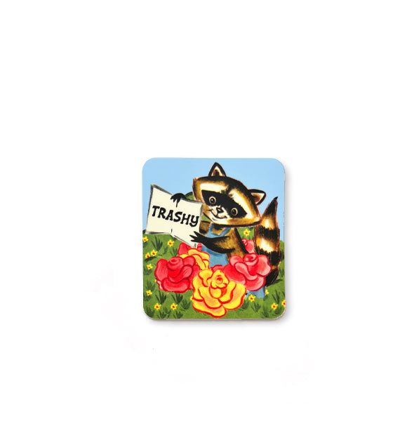 Rectangular sticker with rounded corners features illustration of a smiling raccoon wearing blue overalls in a field of vibrantly colored flowers holding a book open to a page that says, "Trashy"