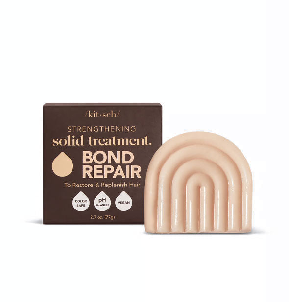 Light-colored, rainbow-shaped Bond Repair hair treatment bar by Kitsch with brown box packaging