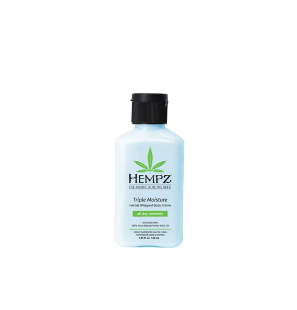 Light blue 2.25 ounce bottle of Hempz Triple Moisture Herbal Whipped Body Crème with black and green lettering and design accents