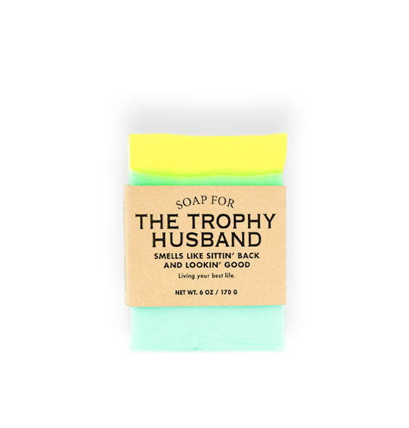 Bar of Soap for the Trophy Husband (Smells Like Sittin' Back and Lookin' Good) is yellow and aquamarine and wrapped in brown paper with black lettering