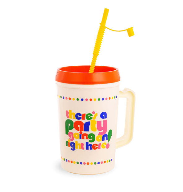 Cream-colored drink tumbler with handle, orange lid, and yellow capped straw says, "There's a party going on right here!" in multicolored lettering