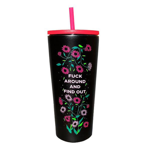 Black drink tumbler with pink lid and straw features delicate floral design surrounding the words, "Fuck around and find out" in white lettering