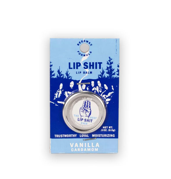 Pot of Vanilla Cardamom Lip Shit Lip Balm on two-tone blue product card features scout's honor hand sign illustration and a background of faces illuminated by a campfire surrounded by trees