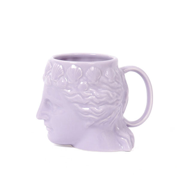 Profile view of purple Venus head coffee mug with scallop seashell details in her hair and handle at back