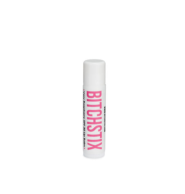 White tube of Bitchstix lip balm with pink lettering