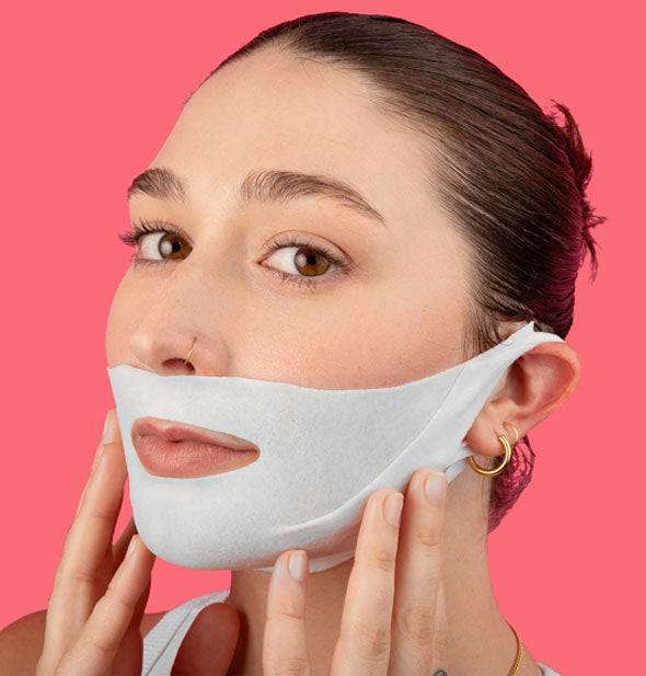 Model demonstrates placement of the Lapcos V-Line Contour Face Sheet Mask