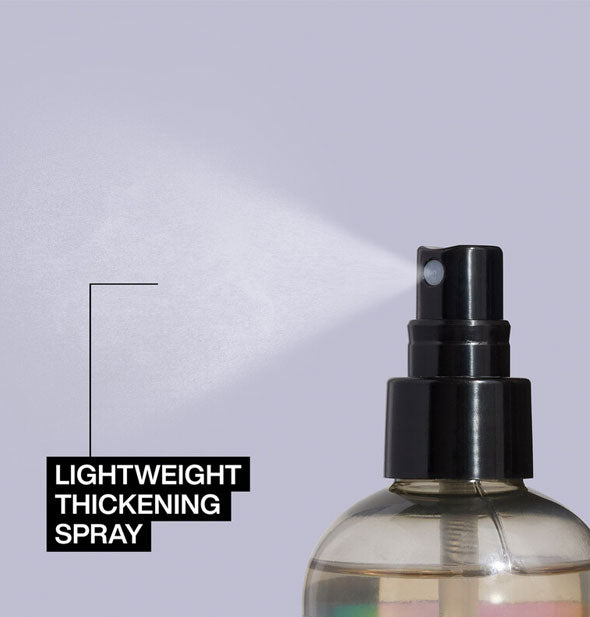 A fine mist is dispensed from a bottle of Redken Volume Maximizer and labeled, "Lightweight thickening spray"