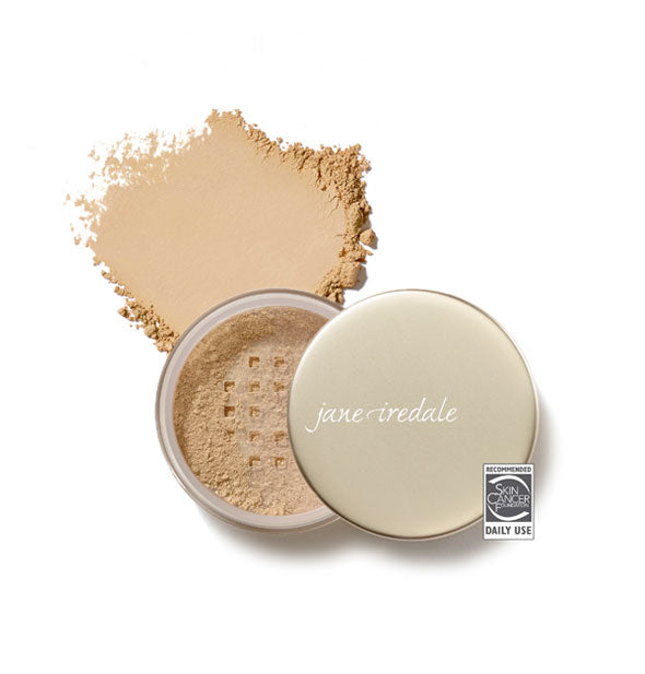 Opened compact of Jane Iredale Amazing Base Loose Mineral Powder and sample product swatch in shade Warm Sienna with the Skin Cancer Foundation seal at lower right