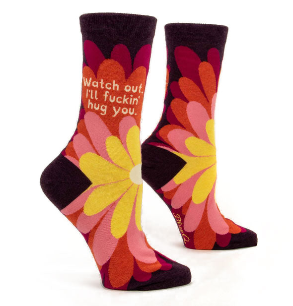 Colorful floral crew socks printed with the phrase, "Watch out. I'll fuckin' hug you."