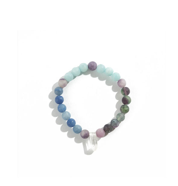 Crystal bead bracelet with blue, green, and purple color scheme around a clear crystal point