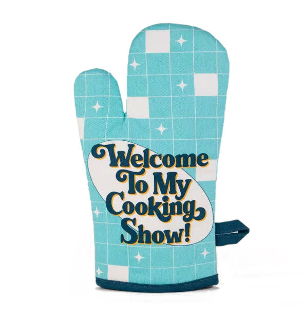 Blue oven mitt with white checkered print and dark blue piping says, "Welcome To My Cooking Show!" in dark blue lettering