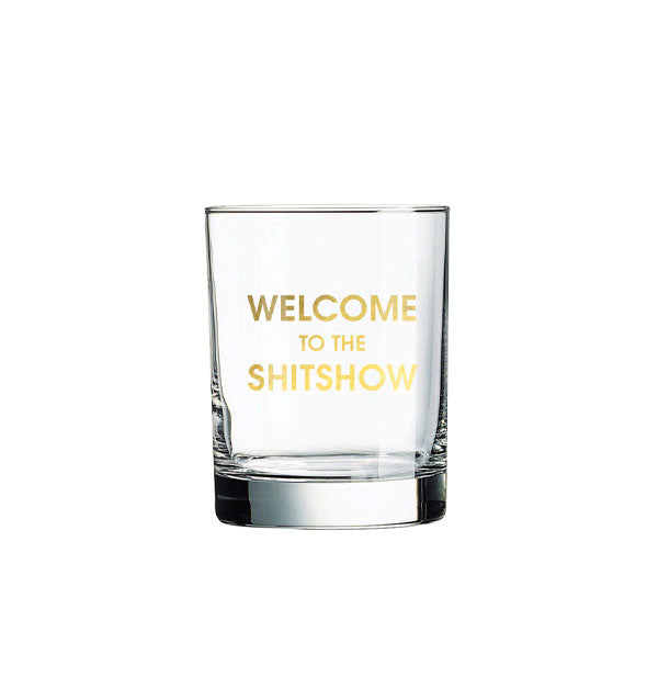 Clear rocks glass says, "Welcome to the shitshow" in metallic gold foil lettering