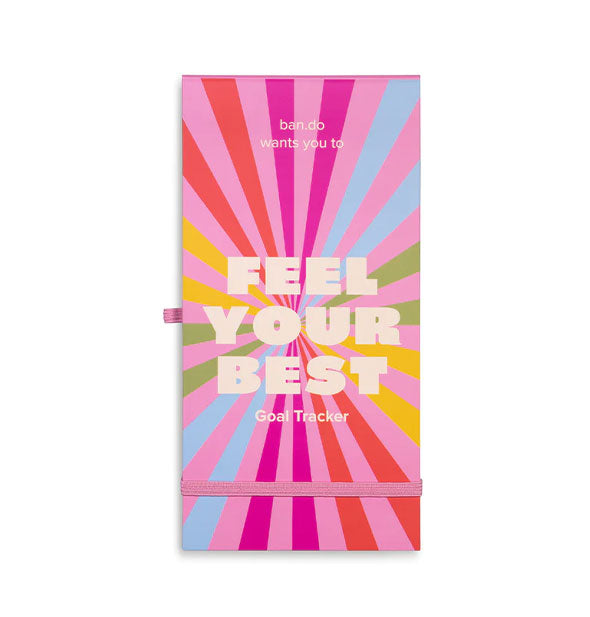 Elongated rectangular notepad by ban.do with colorful radiant design says, "Feel Your Best Goal Tracker" in whitish lettering
